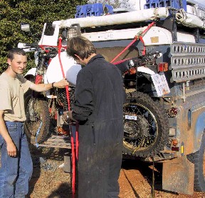 My Yamaha on the rear of Arend's Landrover